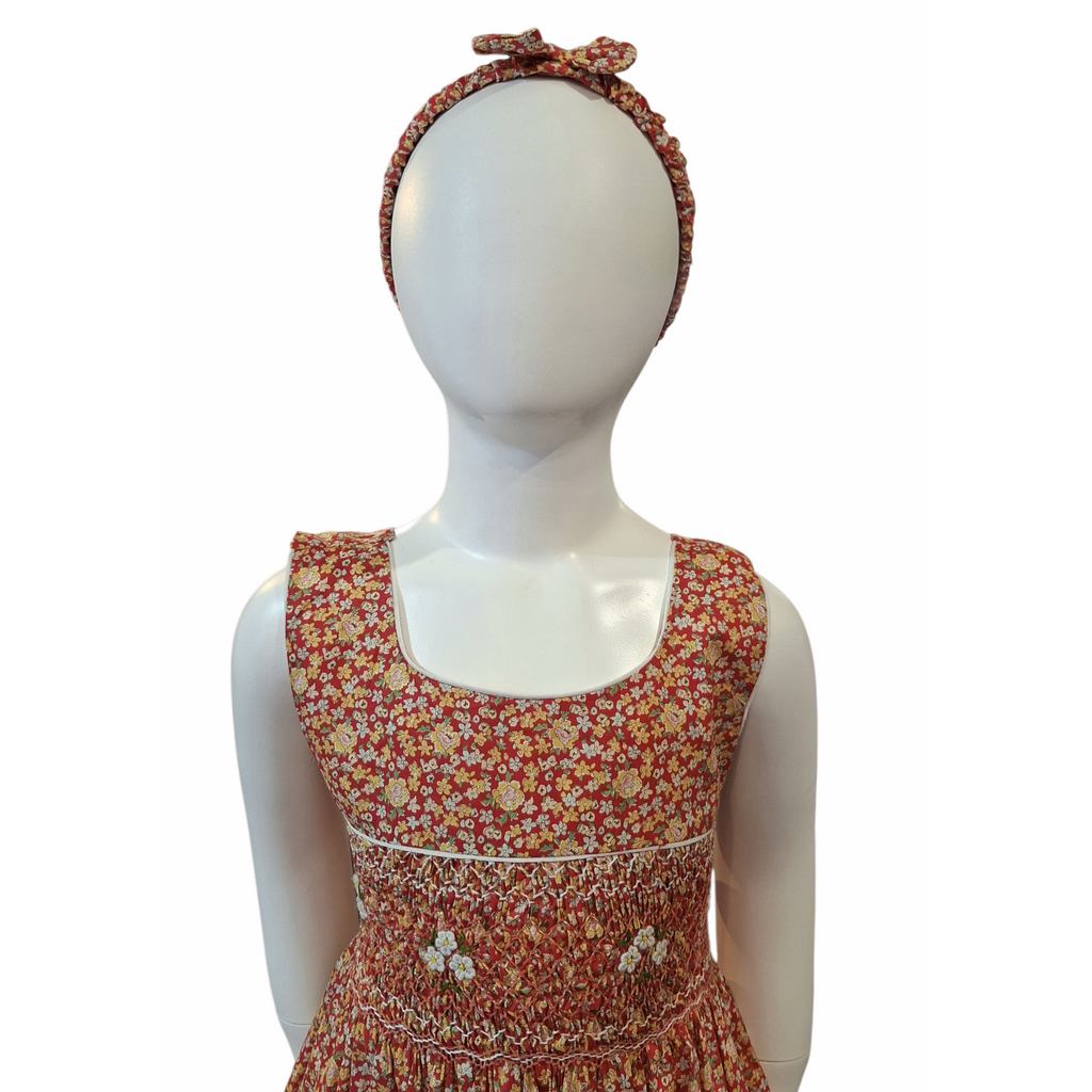 Robe à smocks orange fleuri multicolore. Tissu Goldina dress.