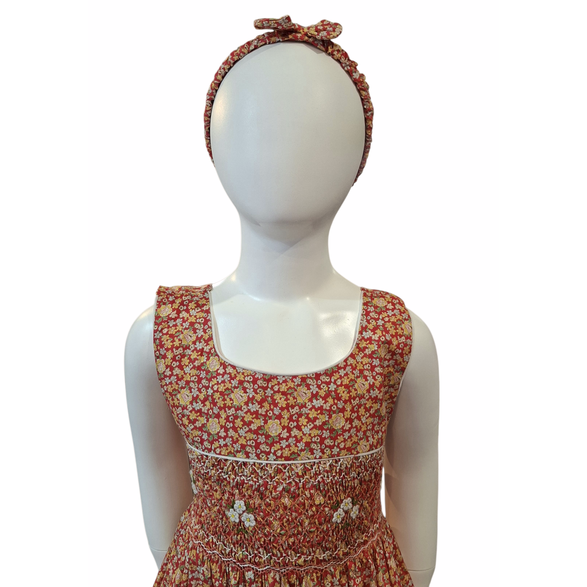 Robe à smocks orange fleuri multicolore. Tissu Goldina dress.