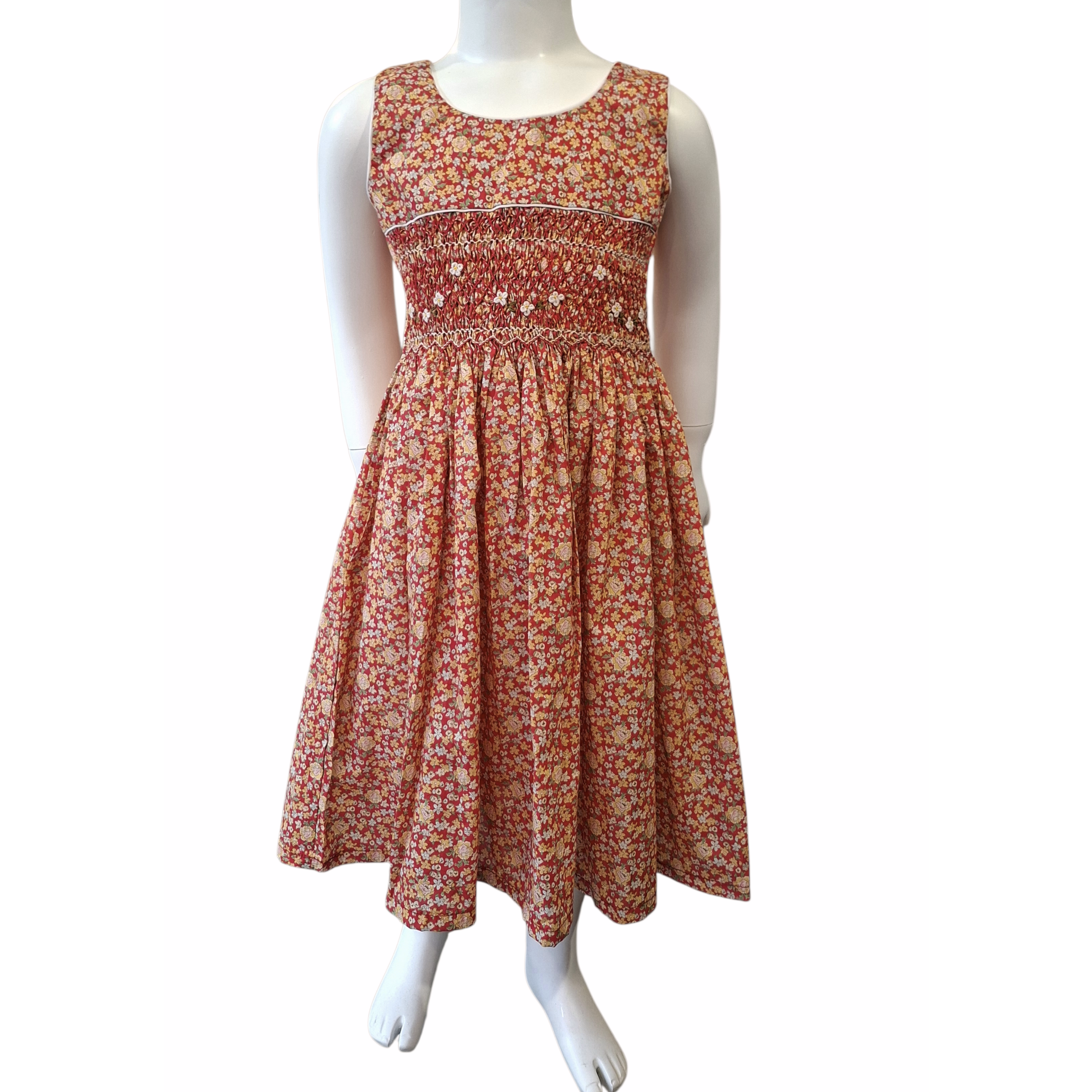 Robe à smocks orange fleuri multicolore. Tissu Goldina dress.