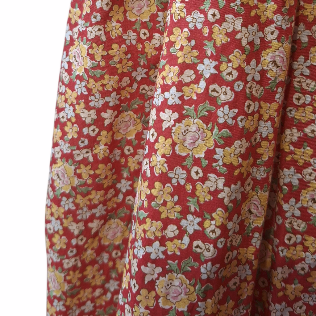 Robe à smocks orange fleuri multicolore. Tissu Goldina dress.