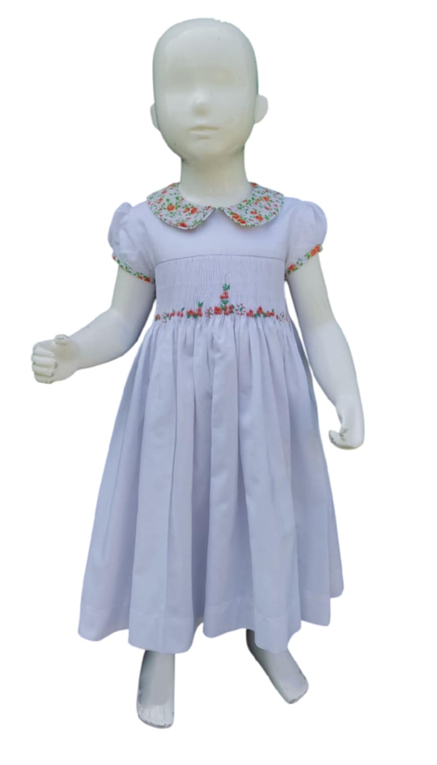 Robe à smocks col claudine fleuri.