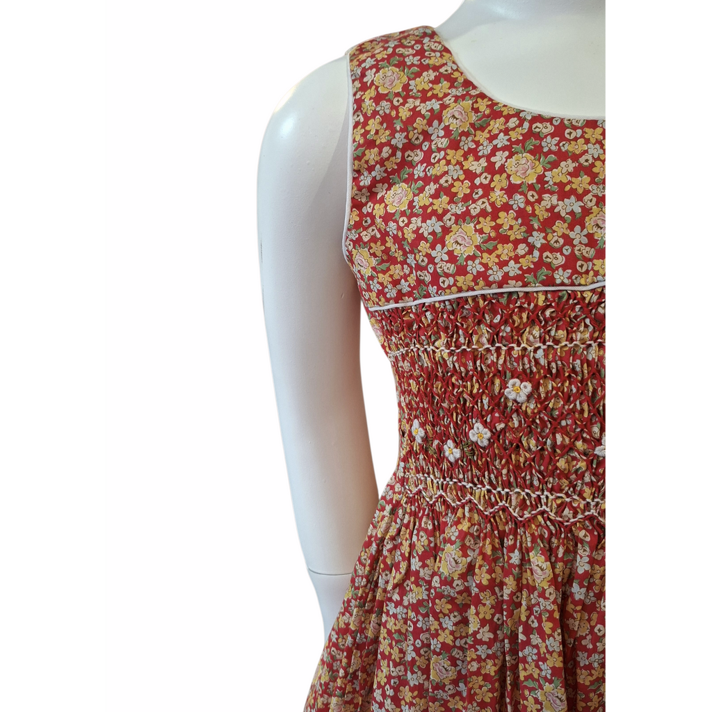 Robe à smocks orange fleuri multicolore. Tissu Goldina dress.